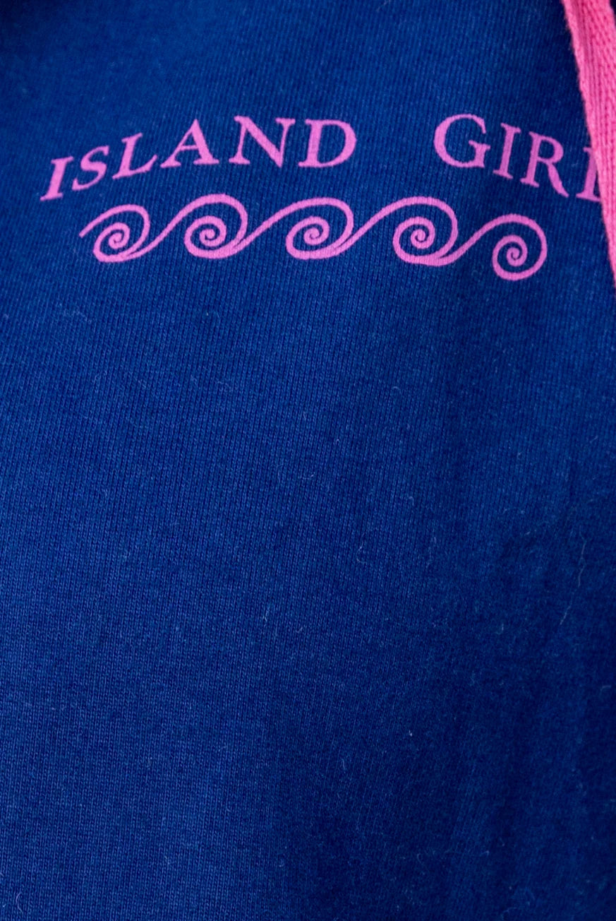 Blue shirt with pink 'Island Girl' text and decorative elements
