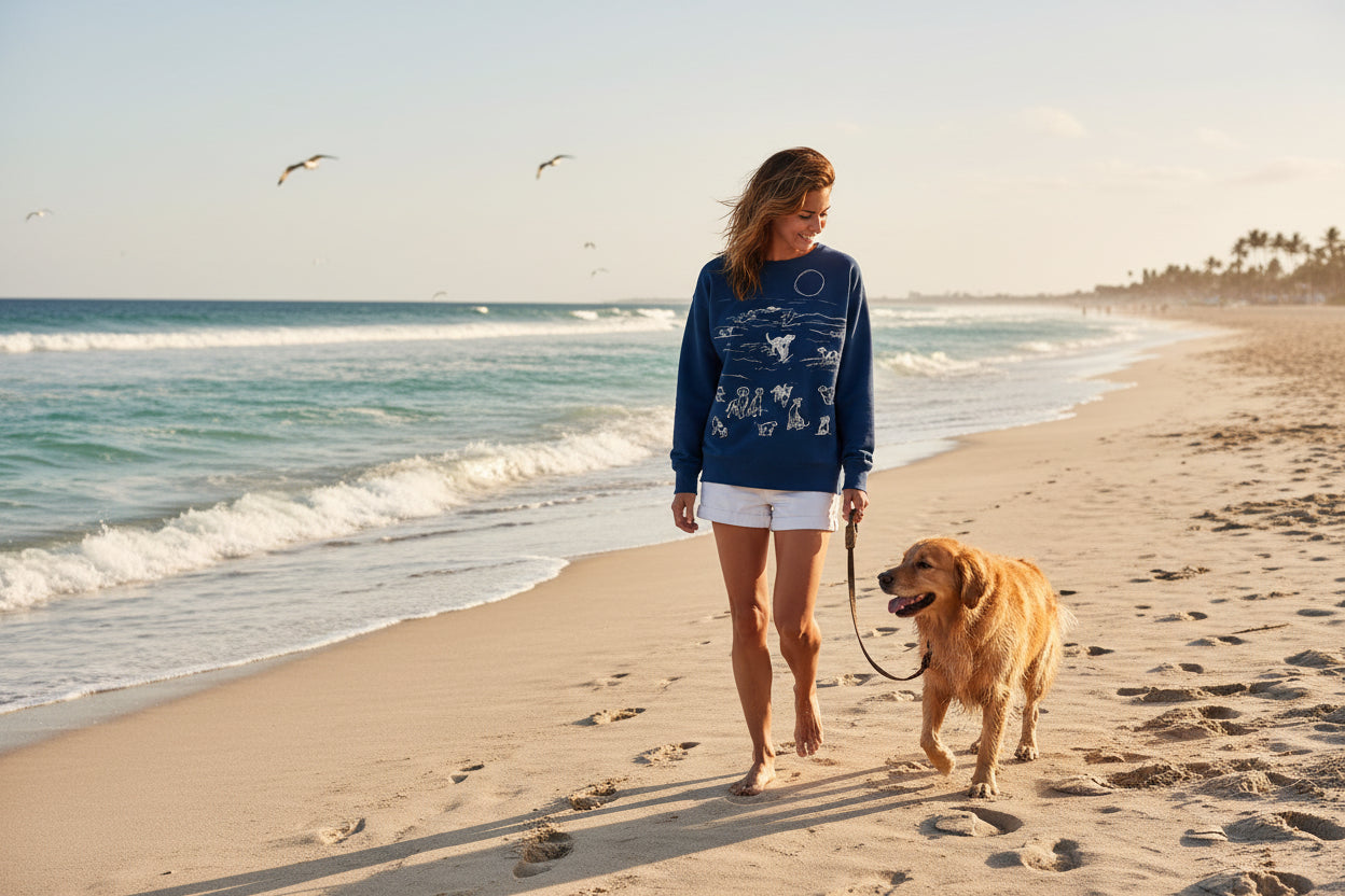 Navy blue sweatshirt with white dog illustrations on a white background