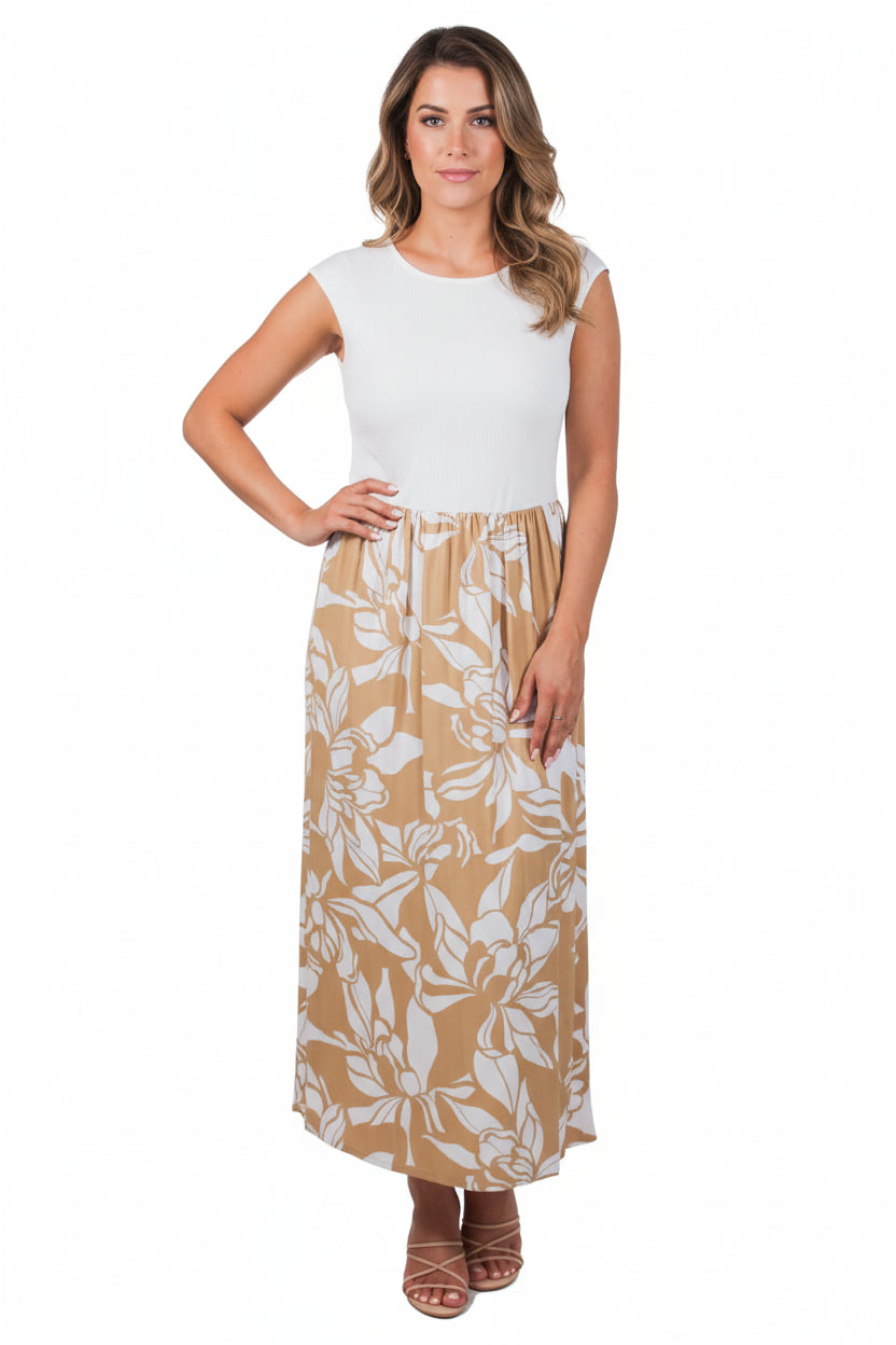 Woman wearing a white top and tan floral skirt on a white background