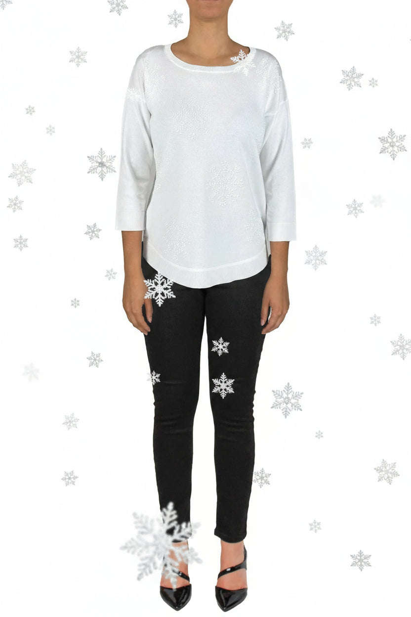 Person wearing a white top and black pants on a white background