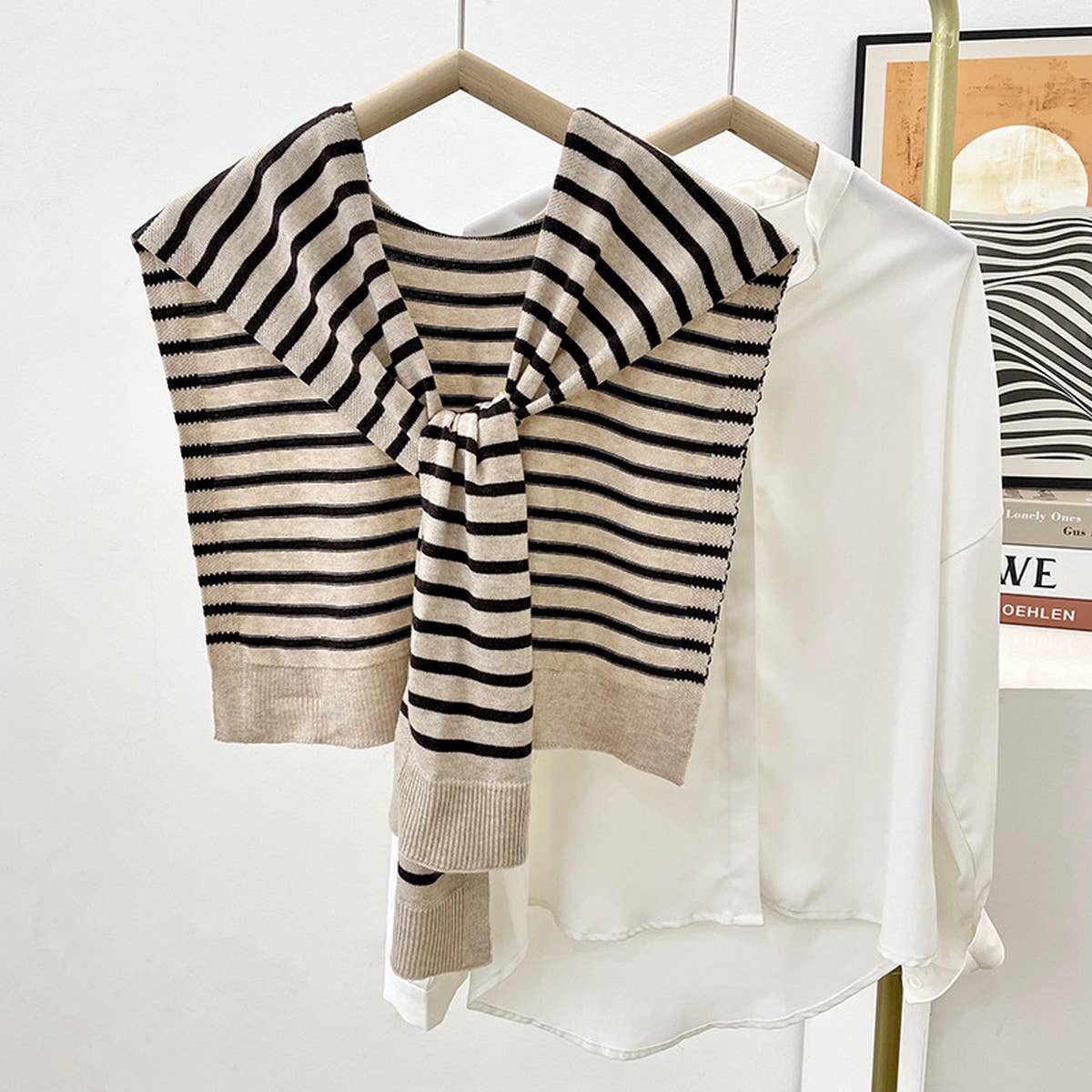 Striped sweater on a hanger with a white background