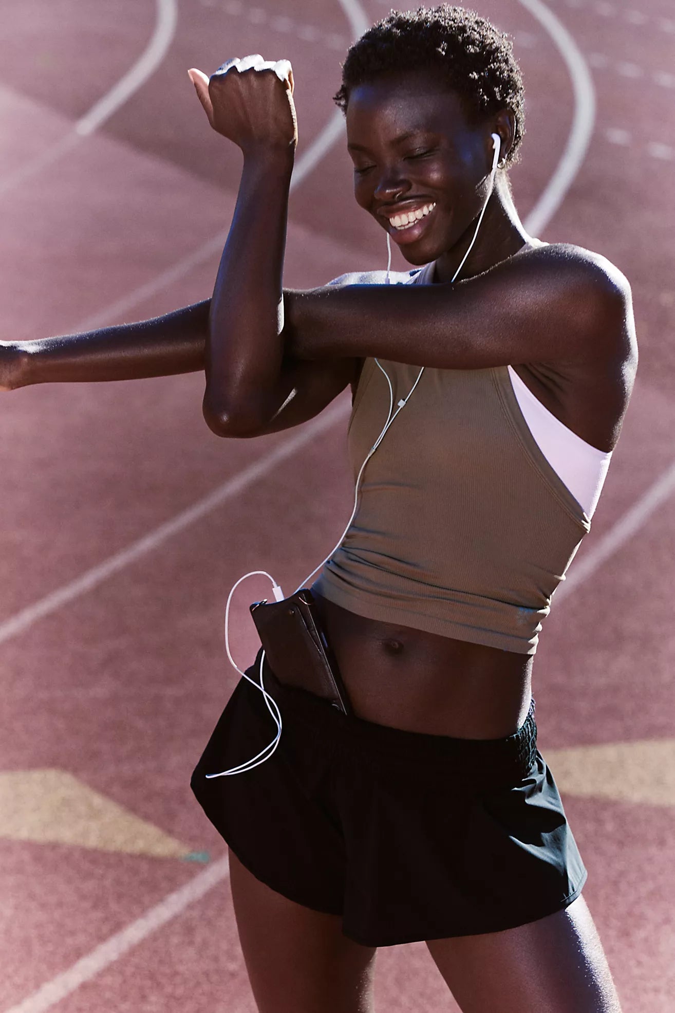 Athlete celebrating on a running track